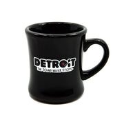 Black diner mug with 'Detroit: The Sound Never Stops' text on a white background